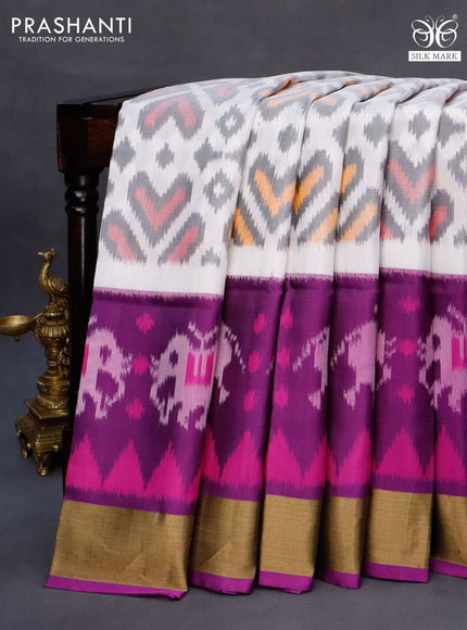 Ikat soft silk saree off white and purple with allover ikat weaves and long ikat woven zari border