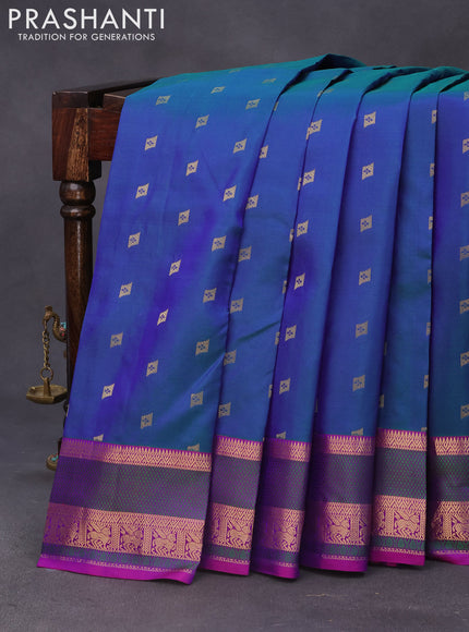 Pure kanchipuram silk saree dual shade of bluish green and purple with zari woven buttas and thread & zari woven border