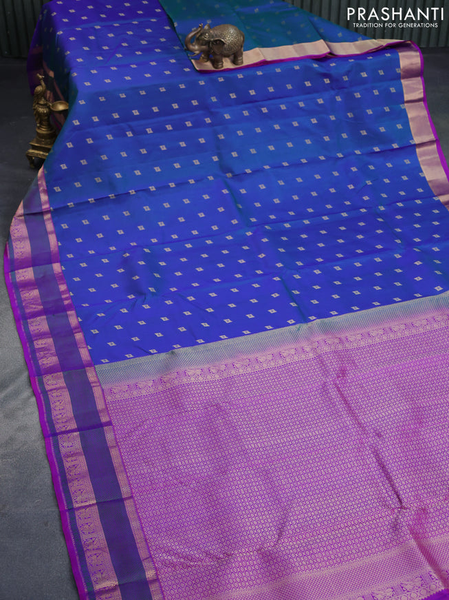 Pure kanchipuram silk saree dual shade of bluish green and purple with zari woven buttas and thread & zari woven border