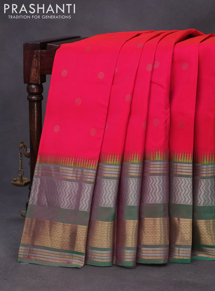 Pure kanchipuram silk saree dual shade of pinkish orange and dual shade of green with zari woven buttas and long zari woven border