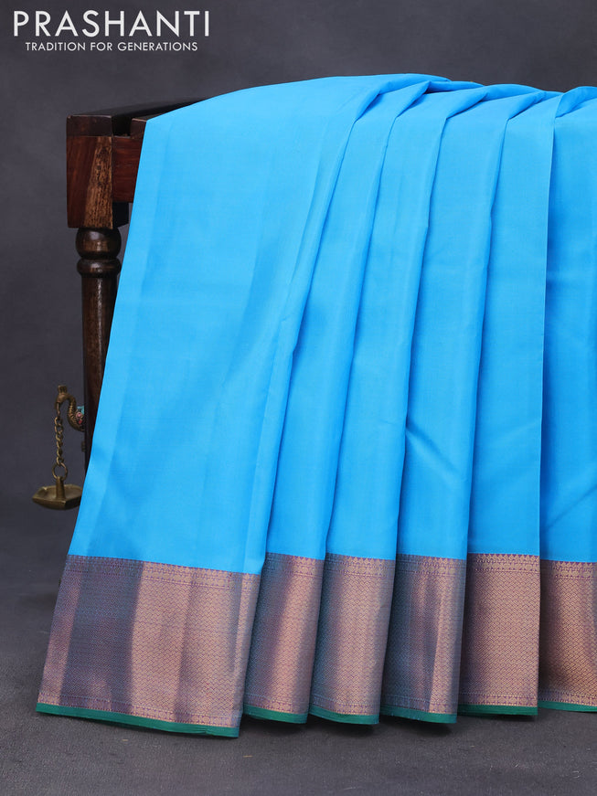 Pure kanchipuram silk saree light blue and green with plain body and zari woven border