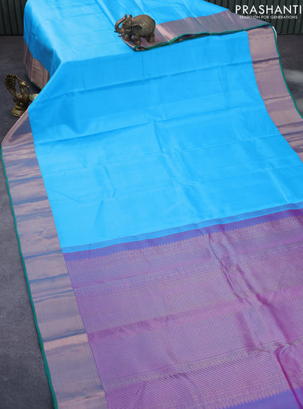 Pure kanchipuram silk saree light blue and green with plain body and zari woven border