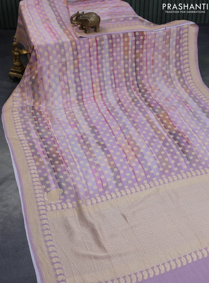 Banarasi georgette silk saree mild lavender shade and mild peach with allover zari woven buttas and zari woven border