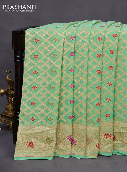 Banarasi georgette silk saree teal green with allover zari weaves & thread buttas and zari woven border