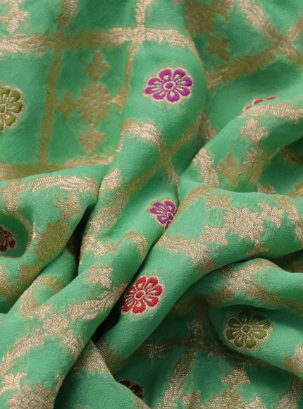 Banarasi georgette silk saree teal green with allover zari weaves & thread buttas and zari woven border