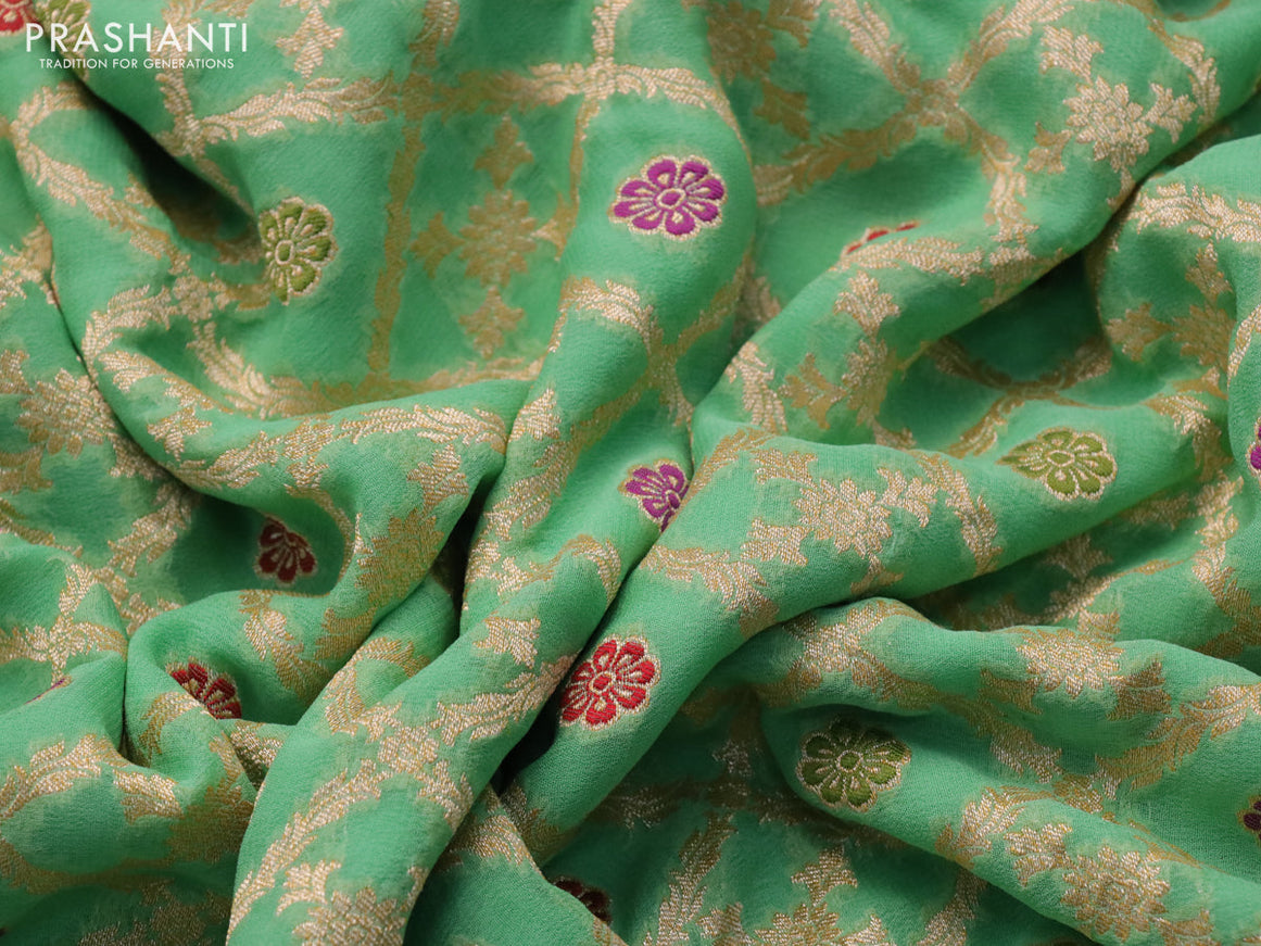 Banarasi georgette silk saree teal green with allover zari weaves & thread buttas and zari woven border