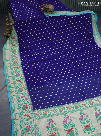 Banarasi georgette silk saree dark blue and teal blue with allover zari woven buttas and zari woven peacock design zari woven paithani border