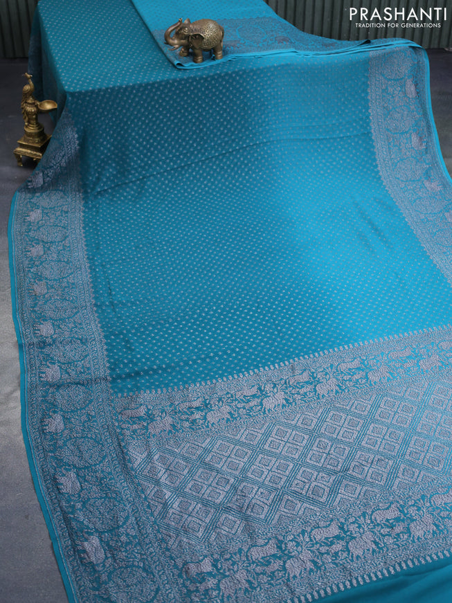 Banarasi georgette silk saree peacock green and teal blue with allover thread & zari butta weaves and long woven border