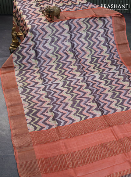 Pure tussar silk saree multi colour and rustic orange with allover wavy prints and zari woven border