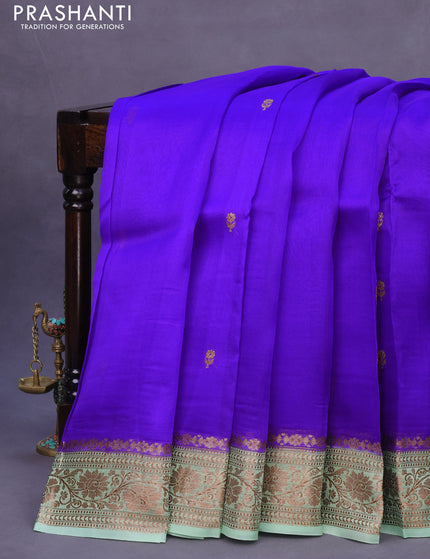 Banarasi organza silk saree royal blue and pastel green with thread & zari woven buttas and banarasi style border