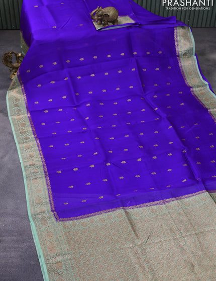 Banarasi organza silk saree royal blue and pastel green with thread & zari woven buttas and banarasi style border