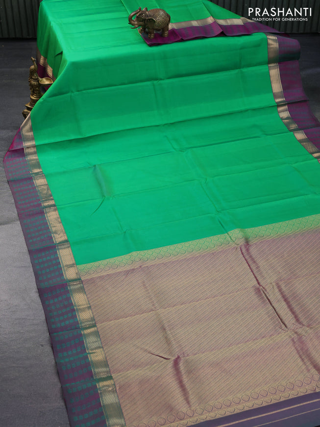 Pure kanchipuram silk saree green and dual shade of purple with plain body and zari woven simple border