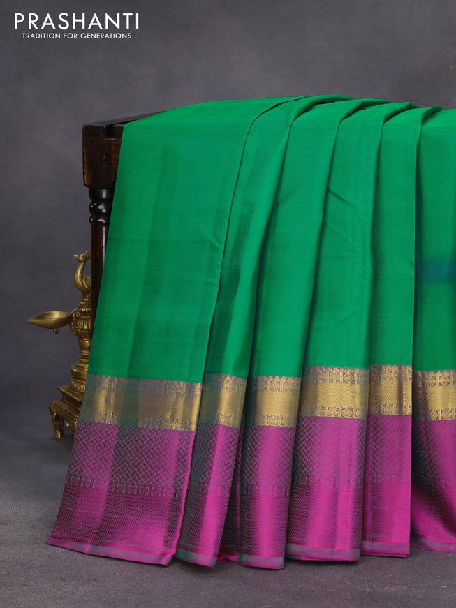 Pure kanchipuram silk saree dual shade of green and dual shade of purple with plain body and long zari woven simple border