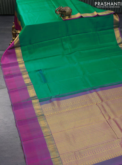 Pure kanchipuram silk saree dual shade of green and dual shade of purple with plain body and long zari woven simple border