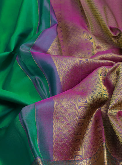 Pure kanchipuram silk saree dual shade of green and dual shade of purple with plain body and long zari woven simple border