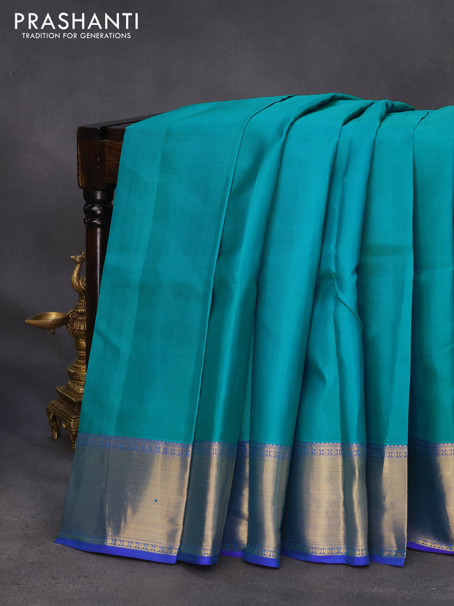 Pure kanchipuram silk saree teal blue and blue with plain body and zari woven border