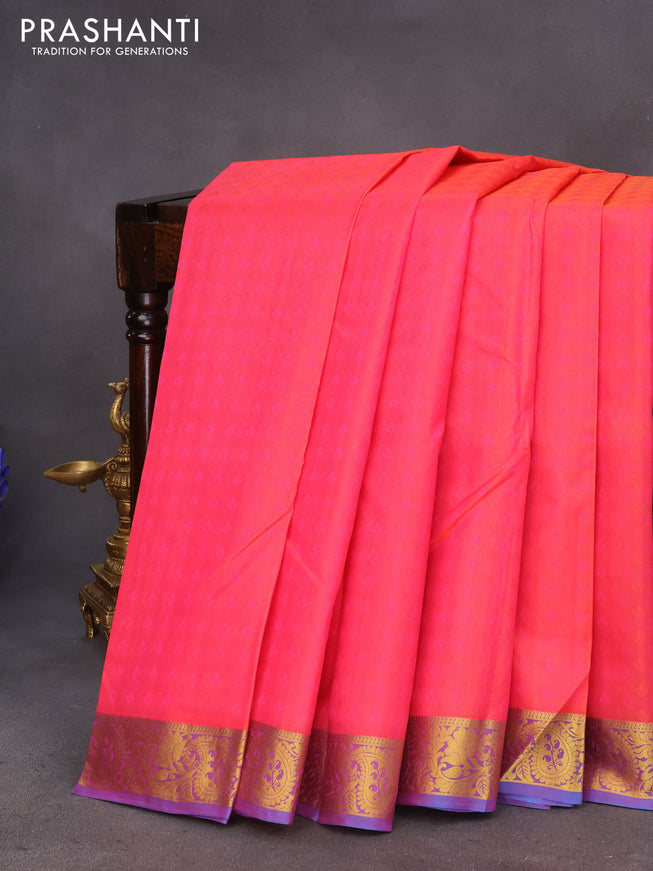 Pure kanchipuram silk saree dual shade of pinkish orange and cs blue with allover self emboss and zari woven border