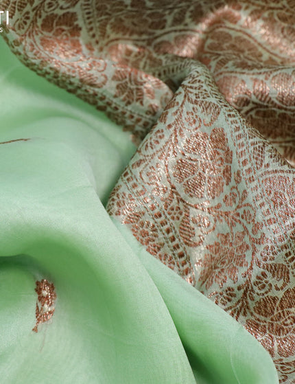 Banarasi organza silk saree pastel green shade with thread & zari woven buttas and banarasi style border