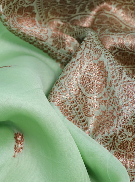 Banarasi organza silk saree pastel green shade with thread & zari woven buttas and banarasi style border