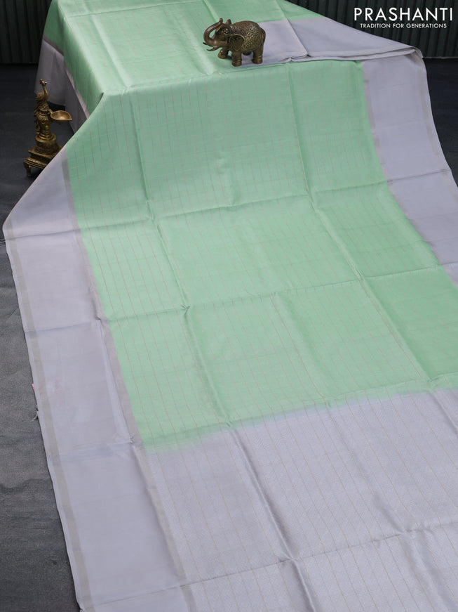 Pure soft silk saree pastel green and pastel grey with allover checked pattern and rettapet silver zari woven border