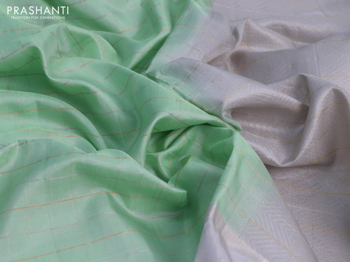 Pure soft silk saree pastel green and pastel grey with allover checked pattern and rettapet silver zari woven border