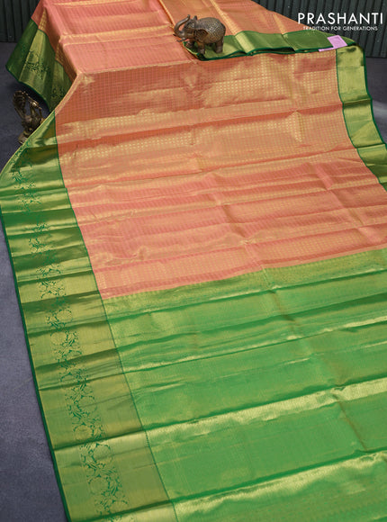 Pure kanchipuram tissue silk saree peach shade and green with allover zari checked pattern and zari woven border