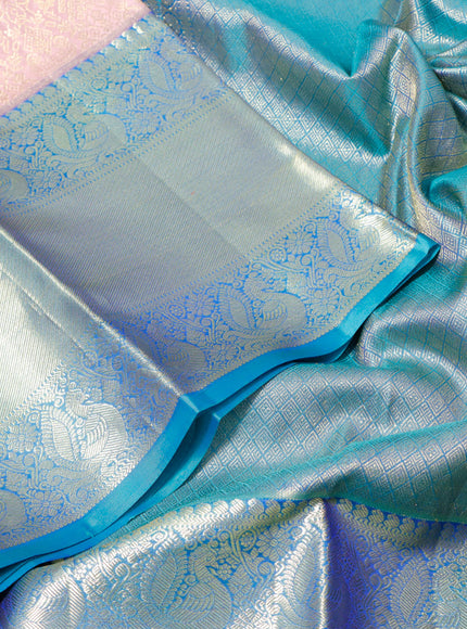 Pure kanchipuram silk saree pastel pink and teal blue with allover zari woven brocade weaves and long zari woven border