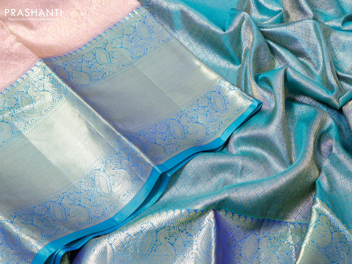 Pure kanchipuram silk saree pastel pink and teal blue with allover zari woven brocade weaves and long zari woven border