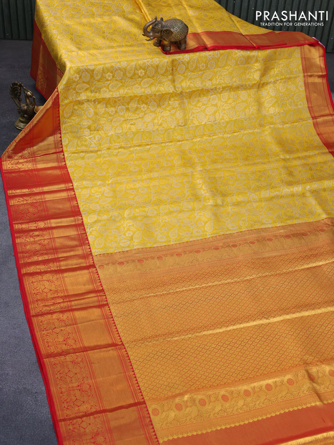 Pure kanchipuram tissue silk saree yellow and red with allover zari woven brocade weaves and long zari woven border