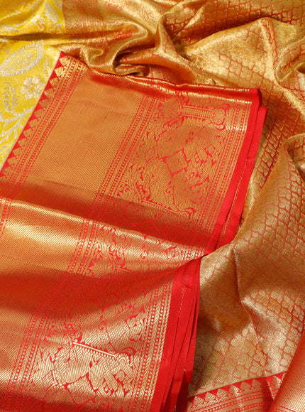 Pure kanchipuram tissue silk saree yellow and red with allover zari woven brocade weaves and long zari woven border