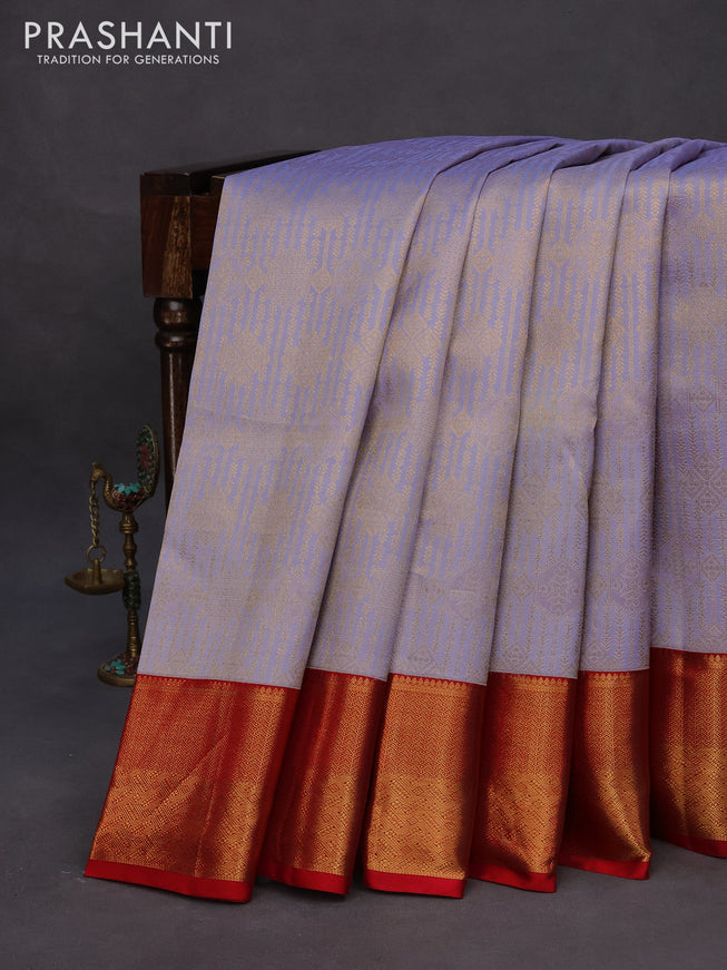 Pure kanchipuram silk saree pastel blue shade and red with allover zari woven brocade weaves and zari woven border