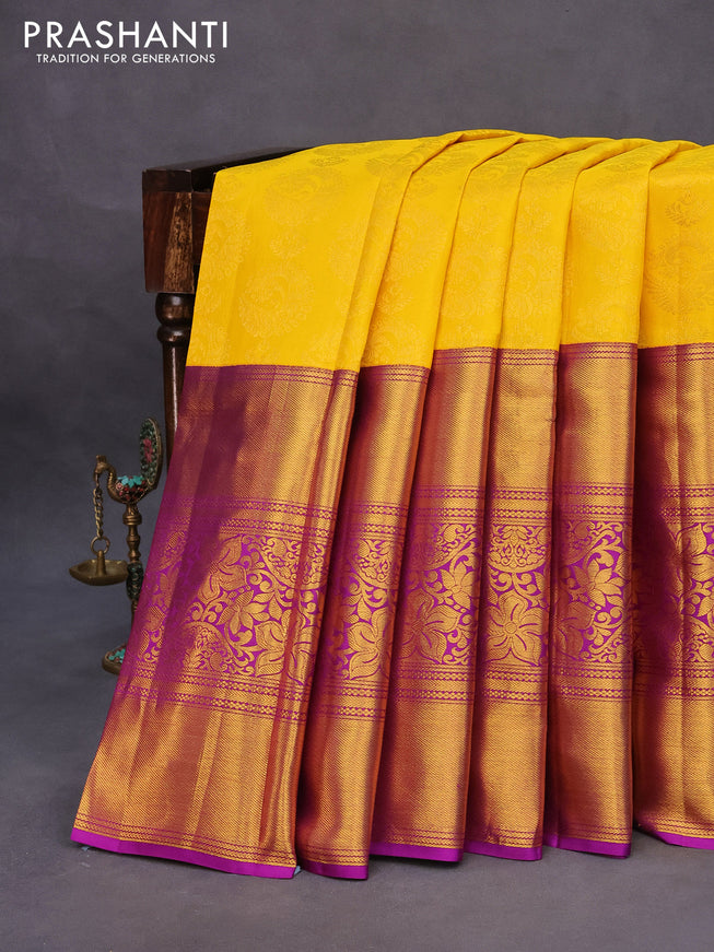 Pure kanchipuram silk saree yellow and purple with allover zari woven brocade weaves and long zari woven border