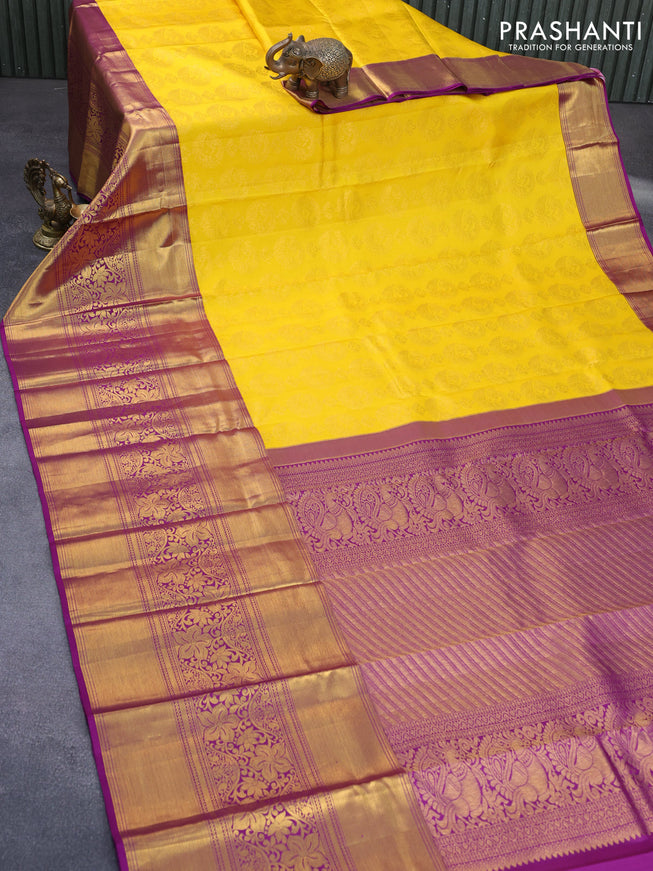 Pure kanchipuram silk saree yellow and purple with allover zari woven brocade weaves and long zari woven border