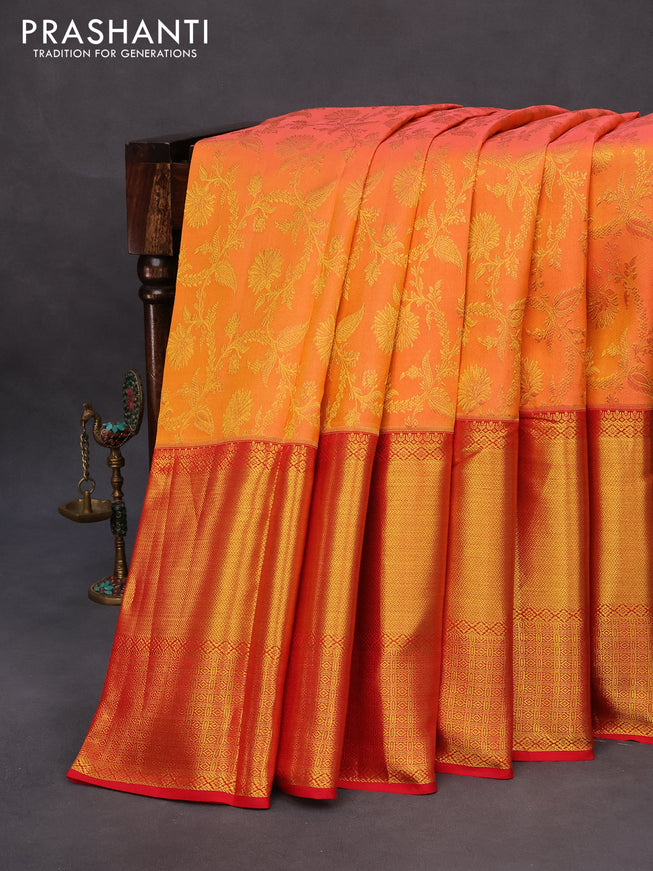 Pure kanchipuram silk saree dual shade of pinkish orange and red with allover zari woven brocade weaves and long zari woven border