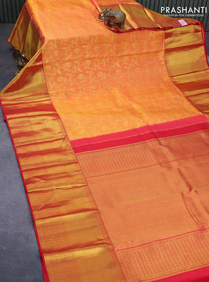 Pure kanchipuram silk saree dual shade of pinkish orange and red with allover zari woven brocade weaves and long zari woven border