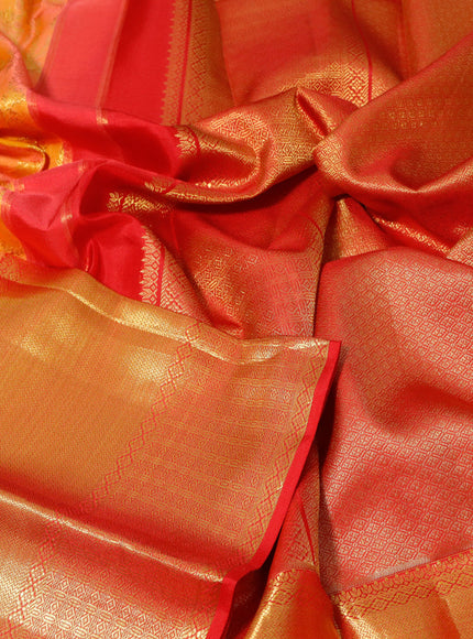 Pure kanchipuram silk saree dual shade of pinkish orange and red with allover zari woven brocade weaves and long zari woven border