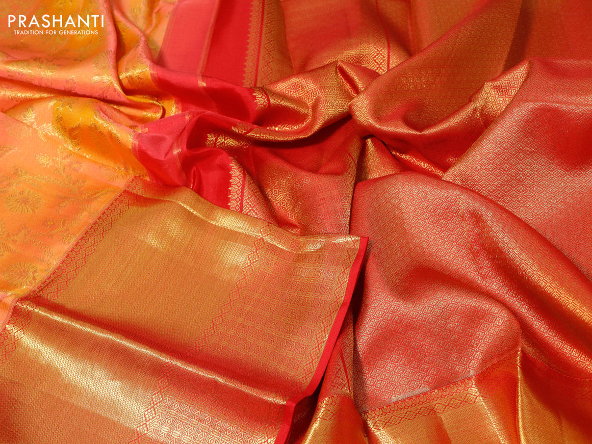 Pure kanchipuram silk saree dual shade of pinkish orange and red with allover zari woven brocade weaves and long zari woven border