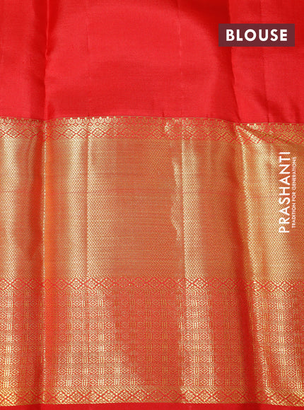 Pure kanchipuram silk saree dual shade of pinkish orange and red with allover zari woven brocade weaves and long zari woven border