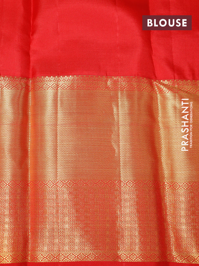 Pure kanchipuram silk saree dual shade of pinkish orange and red with allover zari woven brocade weaves and long zari woven border