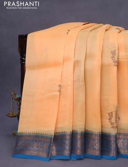 Banarasi organza silk saree pale orange and blue shade with thread & zari woven buttas and banarasi style border