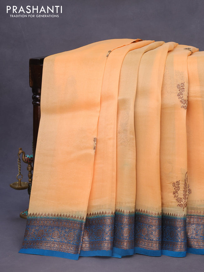 Banarasi organza silk saree pale orange and blue shade with thread & zari woven buttas and banarasi style border