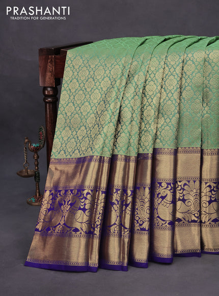 Pure kanchipuram silk saree pastel green and blue with allover zari woven brocade weaves and long annam zari woven border