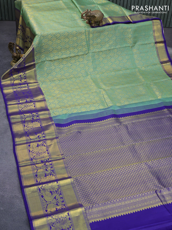 Pure kanchipuram silk saree pastel green and blue with allover zari woven brocade weaves and long annam zari woven border