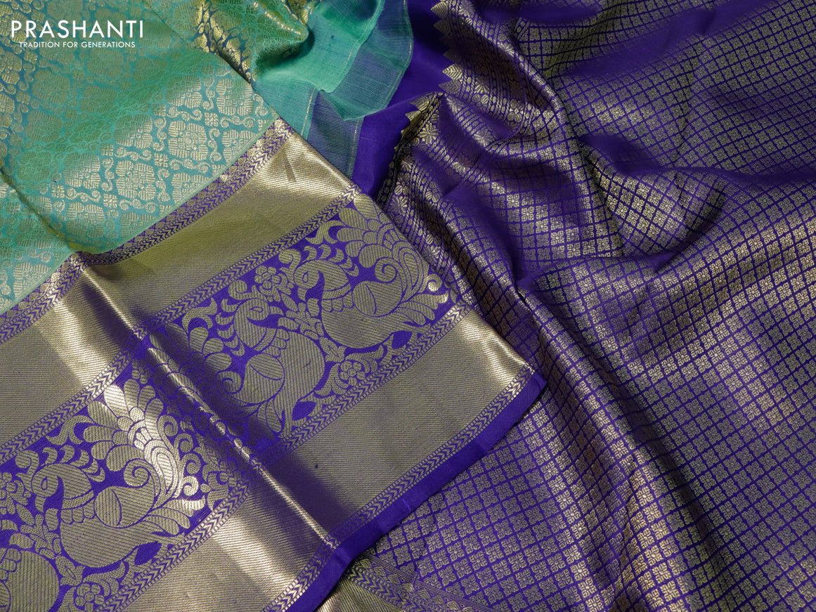 Pure kanchipuram silk saree pastel green and blue with allover zari woven brocade weaves and long annam zari woven border