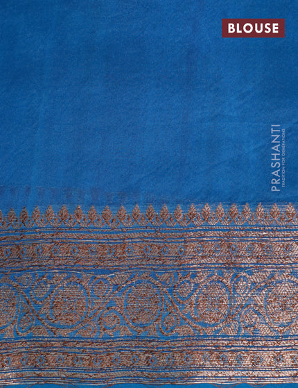 Banarasi organza silk saree pale orange and blue shade with thread & zari woven buttas and banarasi style border