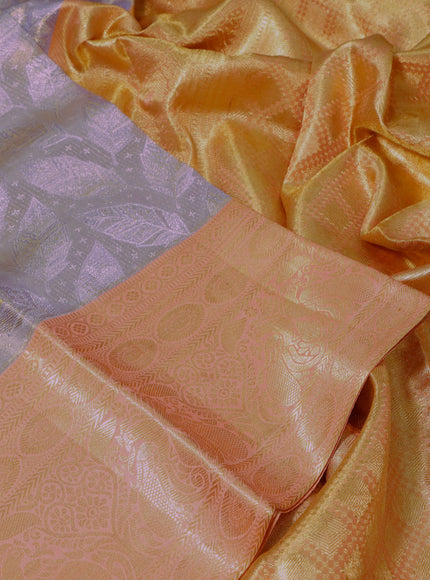 Pure kanchipuram tissue silk saree grey shade and peach shade with allover zari woven brocade weaves and long zari woven peacock design border