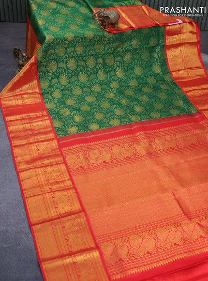 Pure kanchipuram silk saree green and orange with allover zari woven brocade weaves and long zari woven border