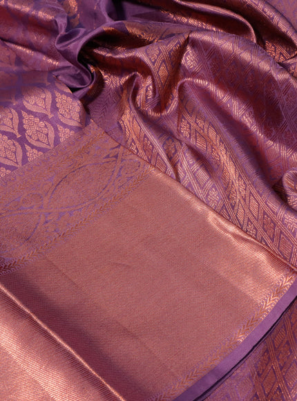 Pure kanchipuram silk saree mild lavender shade with allover copper zari woven butta weaves and long copper zari woven border