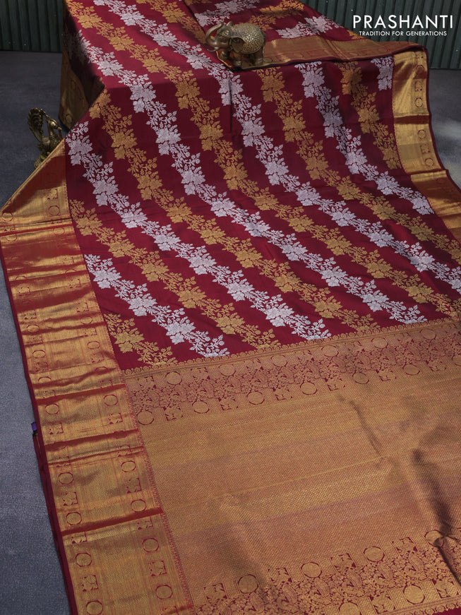 Pure kanchipuram silk saree maroon with allover silver & gold floral weaves and long zari woven border