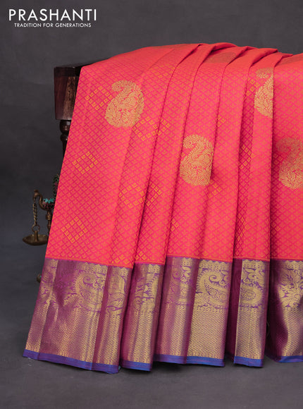 Pure kanchipuram silk saree dual shade of pinkish orange and cs blue with allover self emboss & zari buttas and zari woven border